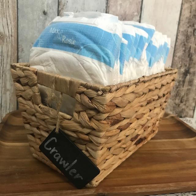Basket with disposable baby nappies